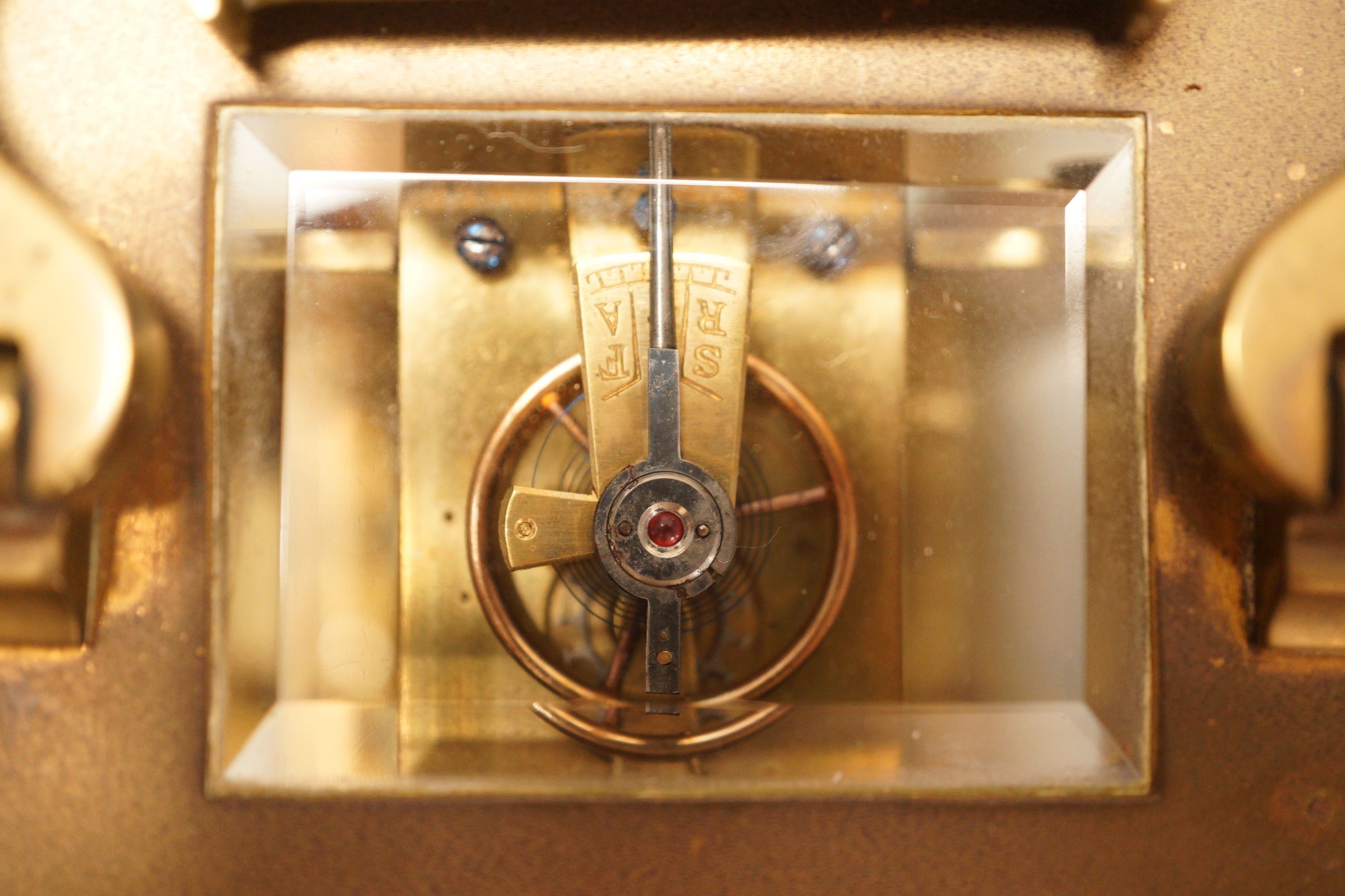 A leather cased brass carriage timepiece, retailed by Bracher & Sydenham